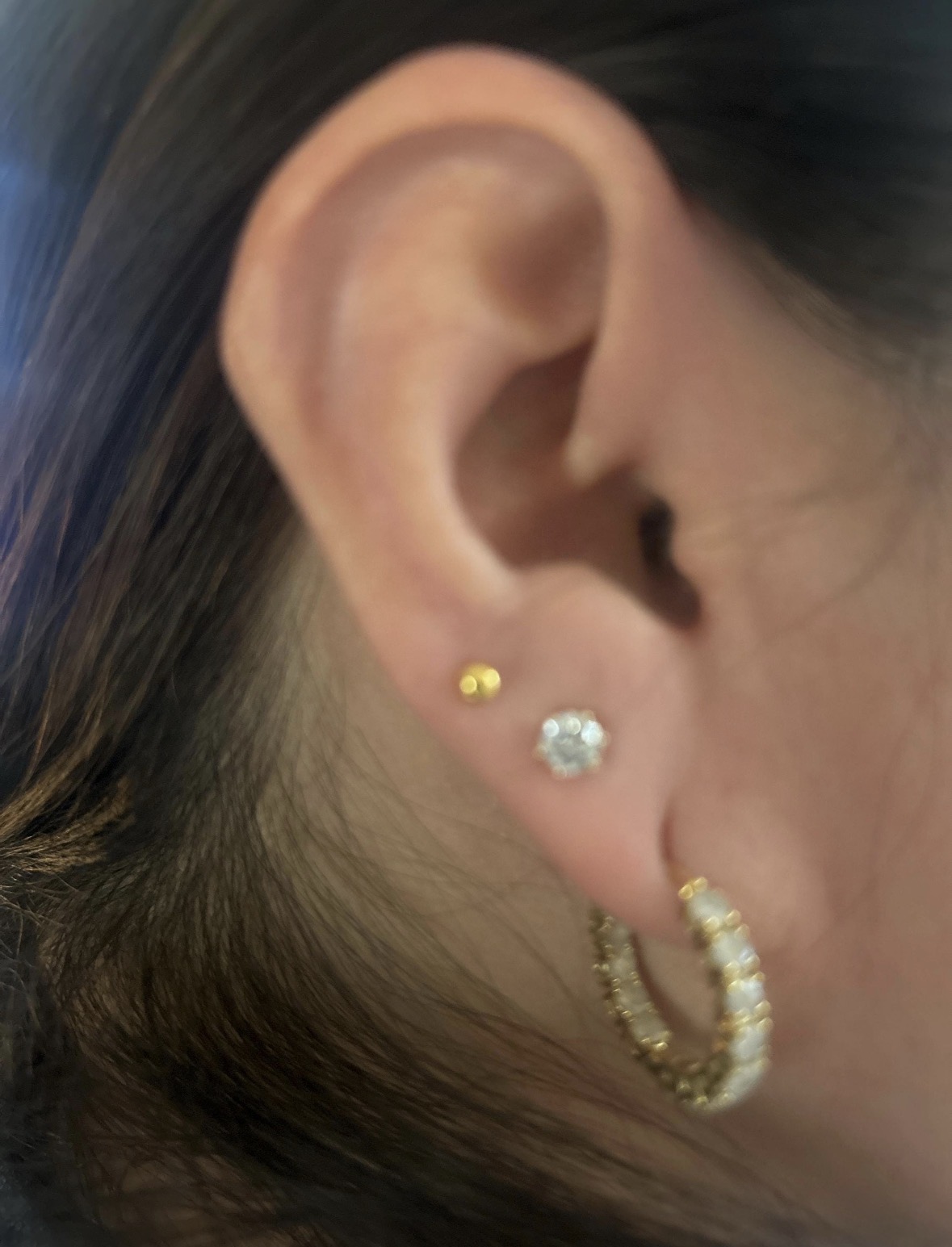 Customer wearing 3mm 24K gold ball earrings